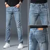 Jeans cropped populares para hombre, nuevo estilo de primavera, elásticos, para personas bajitas, versión coreana, corte ajustado, pantalones de hombre de 9 puntos