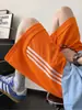 Pantalones cortos deportivos de rayas para hombre, estilo de alta calle americano de verano, pantalones cortos casuales holgados de pierna ancha de moda de longitud media
