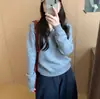 Suéter de punto con cuello en V y manga larga, de estilo coreano y corte relajado para mujer, nueva colección otoño/invierno, top versátil de color liso para usar en capas