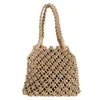 Bolso de Mano Tejido Versátil Primavera/Verano 2026 Bolso Hueco para Mujer Bolso de Punto Nuevo de Moda Estilo Ins Bolso de Playa