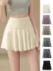 Elegante falda corta deportiva para mujer, de cintura alta, control de abdomen, con shorts de seguridad incorporados para evitar la exposición, adecuada para entrenamiento de yoga, falda-pantalón versátil