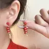 Pendientes festivos de texto de Año Nuevo Rojos Pendientes del año del dragón del Zodiaco Alto sentido sentido de diseño nicho Pendientes de otoño e invierno de Año Nuevo