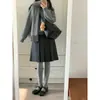 Artículo popular de Xiaohongshu~ Falda midi plisada de mezcla de lana gris oscuro estilo preppy otoño/invierno para mujer, de cintura alta, falda línea A adelgazante