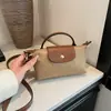 Moda Retro Versátil Transfronterizo Explosiones 2025 Nuevo Bolso de Mujer Hombro Cruzado Portátil a Mano Nylon de Gama Alta Bolso Dumpling