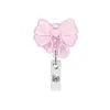 Porta credencial retráctil para tarjeta de identificación Insignia de fábrica fácil de tirar Insignia de trabajo fácil de soltar Moño de mariposa Estudiante Estilo nuevo Patrón de vaca inglesa Hebilla de tracción rosa Insignia de trabajo
