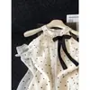 Blusa de gasa de manga larga con lunares estilo francés, cuello halter y perlas para mujer, modelo nuevo 2026, top holgado de hombros descubiertos, color albaricoque, otros