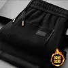 Directo del fabricante: Nuevos pantalones casuales de otoño e invierno, forrados de polar, engrosados, cálidos, corte recto, ajuste holgado, adecuados para mediana edad y personas mayores, disponibles para envío directo