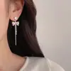 Pendientes largos de borlas de moda y sencillos con lazo para mujer, dulces y juveniles, versátiles y que afinan el rostro, pendientes de botón