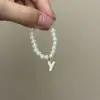 Mini Labubu Cuarta Generación Caja Sorpresa Ropa de Muñeca Collar Colgante Labubu 26 Letras Collar de Perlas Accesorios de Joyería