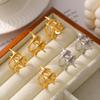 Anillo de estrella de viento frío con revestimiento de acero de titanio chapado en oro real de 18 quilates para hombre y mujer, estilo europeo y americano.