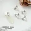 Acessórios Brilhantes de Zircônia para Nail Art em Dourado e Prata, Laço Luxuoso de Alta Qualidade Cravejado de Zircônia com Pingente de Pérola, Decoração de Diamante para Unhas