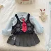 Conjunto de Estilo Universitario para Niñas Otoño 2026 Chaleco de Punto para Niños Camisa Top Falda Plisada Conjunto de Tres Piezas Moderno