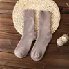 Calcetines de rizo para hombre y mujer calcetines de invierno engrosados de longitud media calcetines de anillo de lana calcetines de mujer color liso calcetines cálidos de toalla venta al por mayor