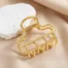 Nuevo pasador de pelo simple estilo coreano con forma de nube, con un toque de alta gama, pinza de metal hueca tipo garra para mujer, accesorio de pinza de tiburón nuevo, versátil y elegante