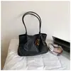 Bolsa de mano tejida casual estilo coreano Shuai Mijia para mujer, nuevo modelo 2026, elegante bolsa de hombro y axila de gran capacidad para el trabajo