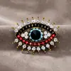 Broche de ojo de diablo transfronterizo europeo y americano, lleno de diamantes, alfiler de ojo vintage, diseño de nicho a la moda, accesorio para traje y bolso