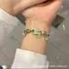 Pulsera tejida a mano estilo chino de doble corazón con amuleto de la suerte entrelazado y cascabel, Joyería versátil de lujo ligero