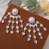 Ins Corea del Sur con borla pequeño corazón perla joyería accesorios diy tejido a mano tocado pendientes material venta al por mayor