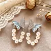 Aretes de Botón Flor Floreciente Mariposa Azul Perla Elegante Ricos y Nobles Flor Floreciente Dopamina Diseño de Alta Gama Pendiente Único