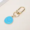 Llavero Colgante de Aleación Más Vendido Transfronterizo, Accesorio Colgante Dorado de Emoji para Bolsa, Set Creativo Colorido para Vacaciones