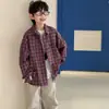 Loja de Algodão Camisa para Meninos Outono 2026 Novo Estilo Coreano Versátil Roupa Infantil de Outono Camisa de Manga Longa Azul Xadrez