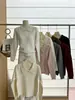 Nueva colección de otoño e invierno: Suéter de punto de manga larga con cuello alto de alta gama, suéter pullover liso estilo coreano, prenda base para mujer