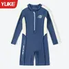 Traje de baño infantil Yuke modelo nuevo para niños de manga larga secado rápido protección solar traje de baño de una pieza para estudiantes bañador al por mayor