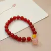 Pulsera original de ágata roja de moda nacional Colgante de calabaza de jade dorado y orquídea de perla Joyería al por mayor