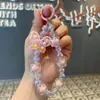 Popular Pulsera de Muñeca para Teléfono de Mariposa Pintada en Acrílico en TikTok - Versátil y Universal para Fundas de Teléfono, Amuletos de Mano, Cadena Antiperdida