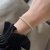 Pulseira redonda pequena de contas de ouro imitação de pérolas para meninas 2024 nova entrada luxo nicho contas pequenas empilhadas vestindo pulseira