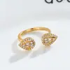 Europa y Estados Unidos decoración de cobre transfronteriza Europa y Estados Unidos moda 18K oro galvanizado circonita anillo abierto anillo de gota de agua para mujer en stock