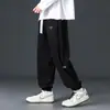 Calças casuais de veludo cotelê para outono para homens, novas calças jogger de retalhos de chenille com corte solto, calças de moletom esportivas de marca da moda