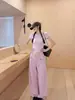 Moda de otoño, pantalones casuales suaves de color blanco roto de pierna ancha con bolsillos delanteros, pantalones fluidos hasta el suelo, pantalones de chándal rectos holgados y estilizados