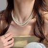 Collar de perlas retro francés para mujer, cadena de clavícula ligera de lujo con diseño de nicho, estilo popular 2025.
