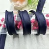 En stock 1cm tela de color banda para cinturón de madre tira para envolver cuerda enrollable funda de almohada colcha zapatos y sombreros para visita a domicilio accesorios de ropa cincha