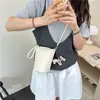 Bolso para Teléfono Móvil Versátil Transfronterizo 2026 Nueva Colección Primavera y Verano para Mujer, Bolso Pequeño con Diseño Vertical y Colgante de Pony, Bolso Pequeño Cruzado de un Solo Hombro