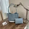 Bolsa de playa tejida hueca de venta caliente para mujer, nuevo modelo 2026, bolso de hombro exquisito, bolsa de playa casual para vacaciones