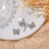 Joyería de uñas de mariposa de ojo de gato de lujo ligero, tridimensional, súper brillante, aleación de circón, diamante hueco, accesorios de uñas de bricolaje al por mayor