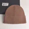 2022 nuevo gorro de punto con volantes de color liso para mujer, gorro de invierno de otoño e invierno, gorro de lana cálido de comercio exterior, combina con todo
