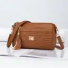 2026 Nuevo Bolso tipo almohada de diseño de nicho transfronterizo con patrón de diamantes y borlas, Bolso de hombro moderno, Bolso cruzado pequeño versátil y elegante