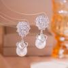 Aretes de aguja de plata de metal plateado simple, aretes de moda comodín, aretes de viento frío de nicho con temperamento de alta gama, venta al por mayor