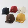 Sombrero de color sólido versátil para bebé con ala suave al por mayor nuevo sombrero solar transpirable para niño pequeño gorra de béisbol linda de cachorro para bebé
