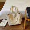 Outono de 2026 Nova Bolsa Casual Grande Capacidade Feminina de Ombro Único Bolsa Tote Transversal para Estudante Aula Trajeto Bolsas Femininas Atacado