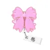 Hebilla retráctil de fácil extracción transfronteriza, acrílico, hebilla de clip para insignia giratoria de dinosaurio con lazo rosa de acrílico de fácil extracción