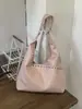Bolsa Tote Personalizada com Rebites Cor Sólida de Grande Capacidade Design de Nicho para Mulheres 2026 Primavera Novo Estilo Bolsa de Ombro Único