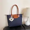 2026 Nueva Moda Popular Elegante Estilo Coreano Personalidad Ins Bolso Casual Bolso Tote de Hombro Axila Bolso Cruzado para Mujer