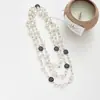 Colección Larga de Collares Superpuestos de Perlas Swarovski para Mujer, Estilo Lujo Ligero, Cadena Versátil para Suéter con un Toque de Alta Gama, Venta al por Mayor Otoño e Invierno