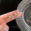 Brincos de tarracha personalizados com laço de diamante celebridade da internet 2022 novos pequenos requintados brincos de design nicho para mulheres