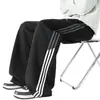 Pantalones de chándal a rayas personalizados/estilo americano, nueva colección de otoño, corte holgado, efecto de caída, bordado en bloques de color, versátiles para deportes y uso casual