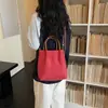 Bolso de mano de cuadros de nicho estilo coreano para mujer, nueva moda primavera 2026, simple y elegante, bolso de hombro y cruzado de alta gama